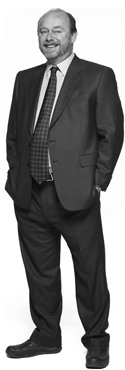  Man with hands in pockets in suit