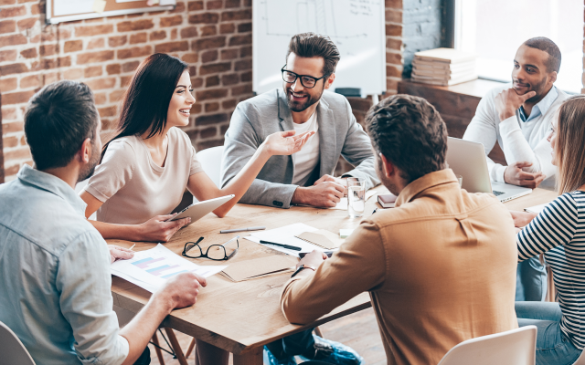 People sitting round table in meeting