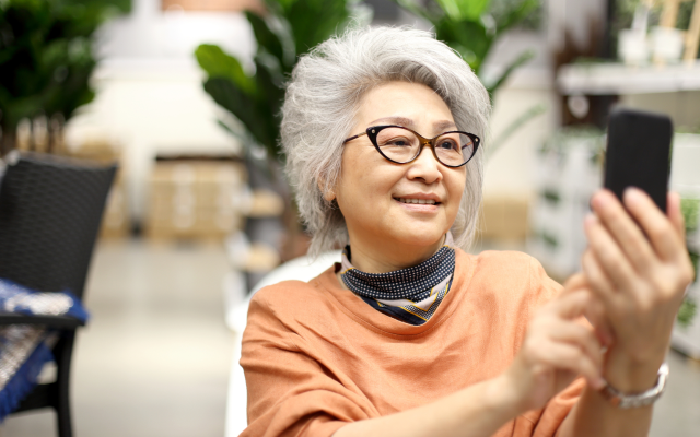 Woman smiling at mobile