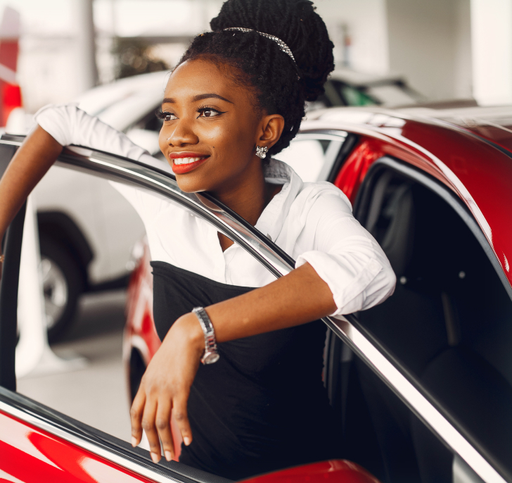 Woman standing with new car