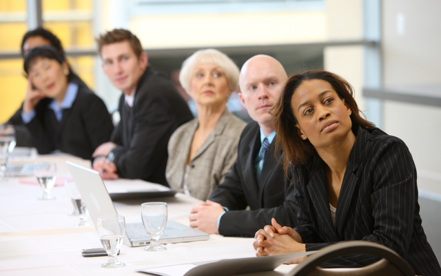 People listening in meeting