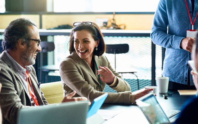 Woman and man chatting in meeting