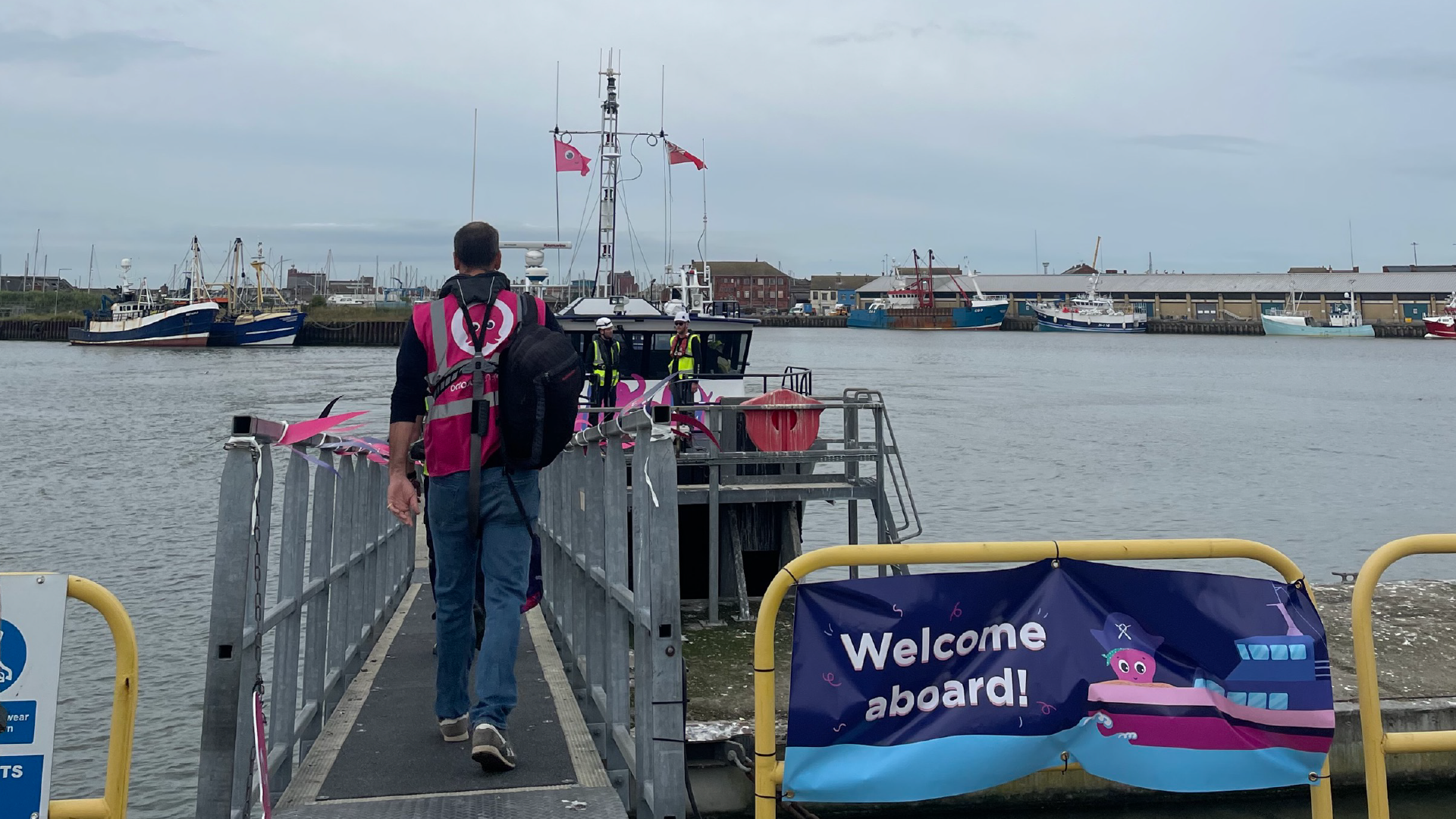 Image of man walking onto a boat at Lincs wind farm site