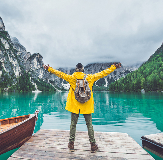 Man facing the mountains and lakes