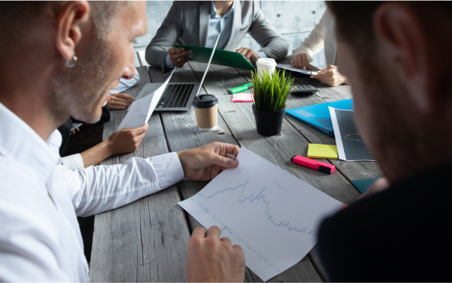 People looking at paperwork in a meeting