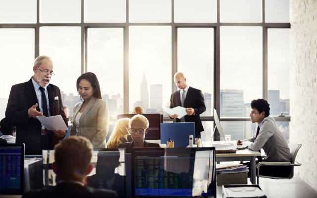 People in an office meeting with a view