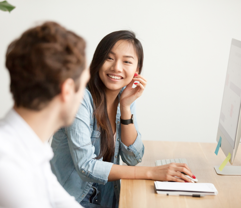 Woman smiling at computer