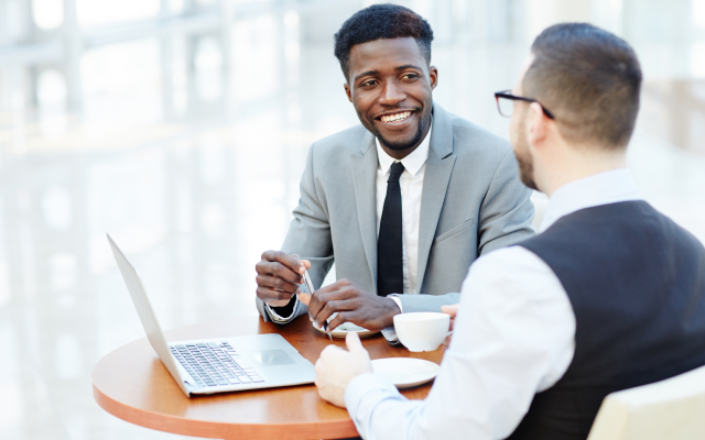 Two men having meeting with coffee