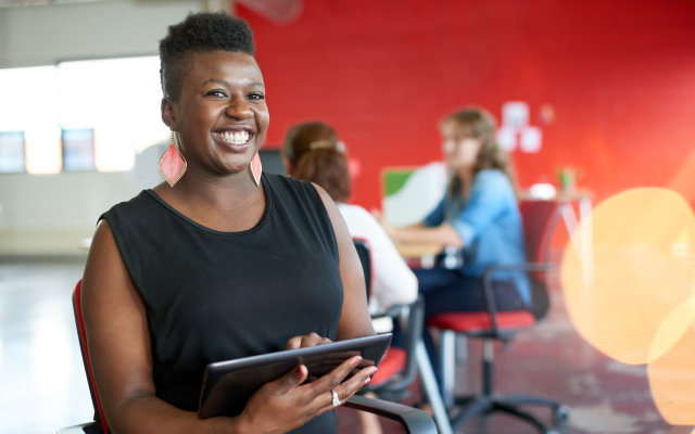 Woman on tablet in office