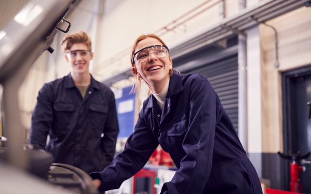 Woman and man working in garage