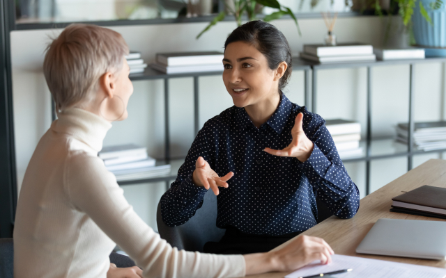 two woman having a meeting