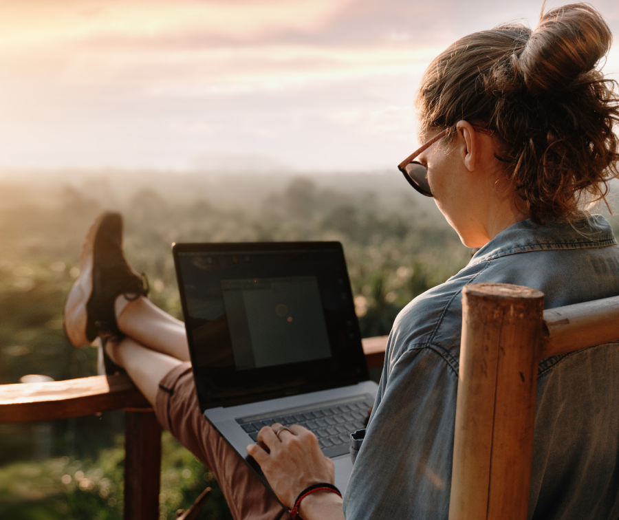 Person sitting looking at laptop screen