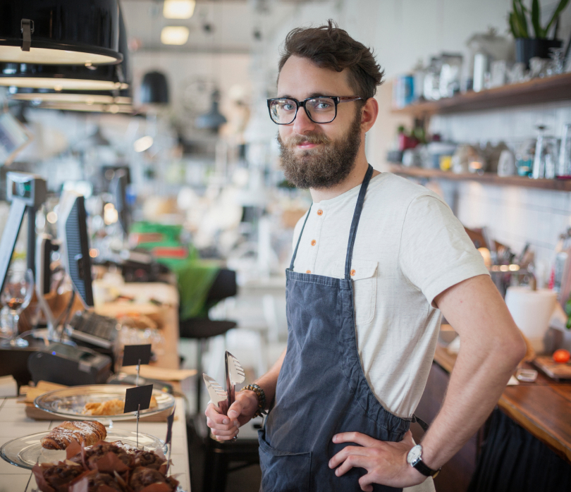 Worker behind the counter in a coffee shop