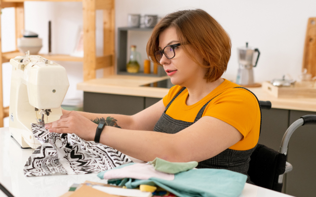 Woman sitting at a sewing machine