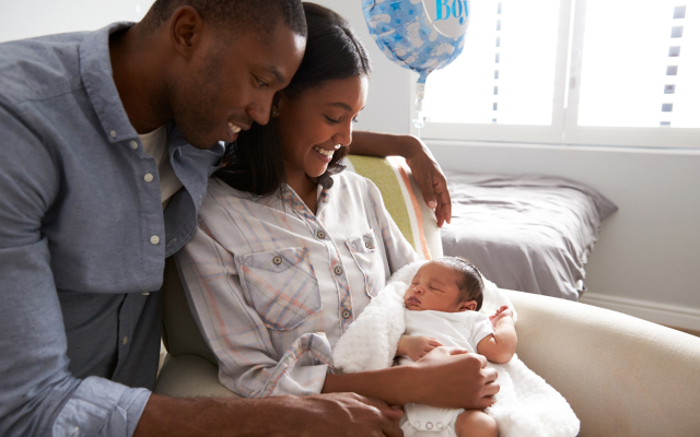 Image of couple holding a newborn baby