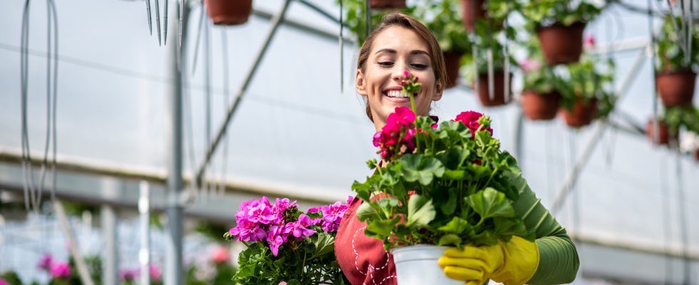 Woman holding flower pots