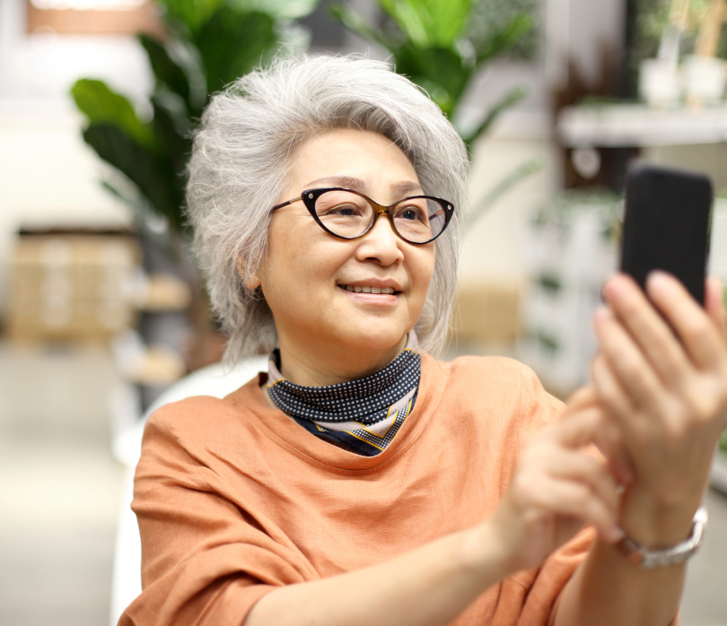 Older woman looking at smartphone