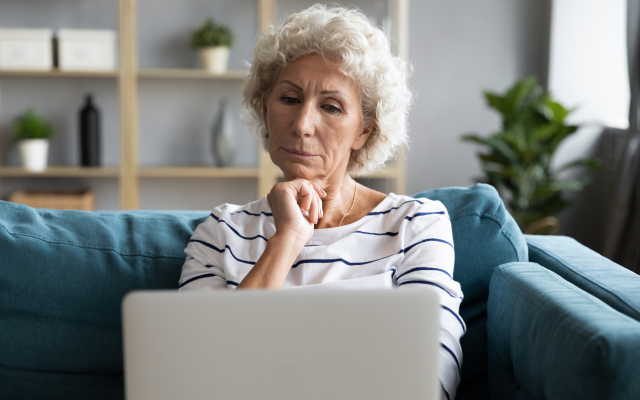 Older woman looking at laptop